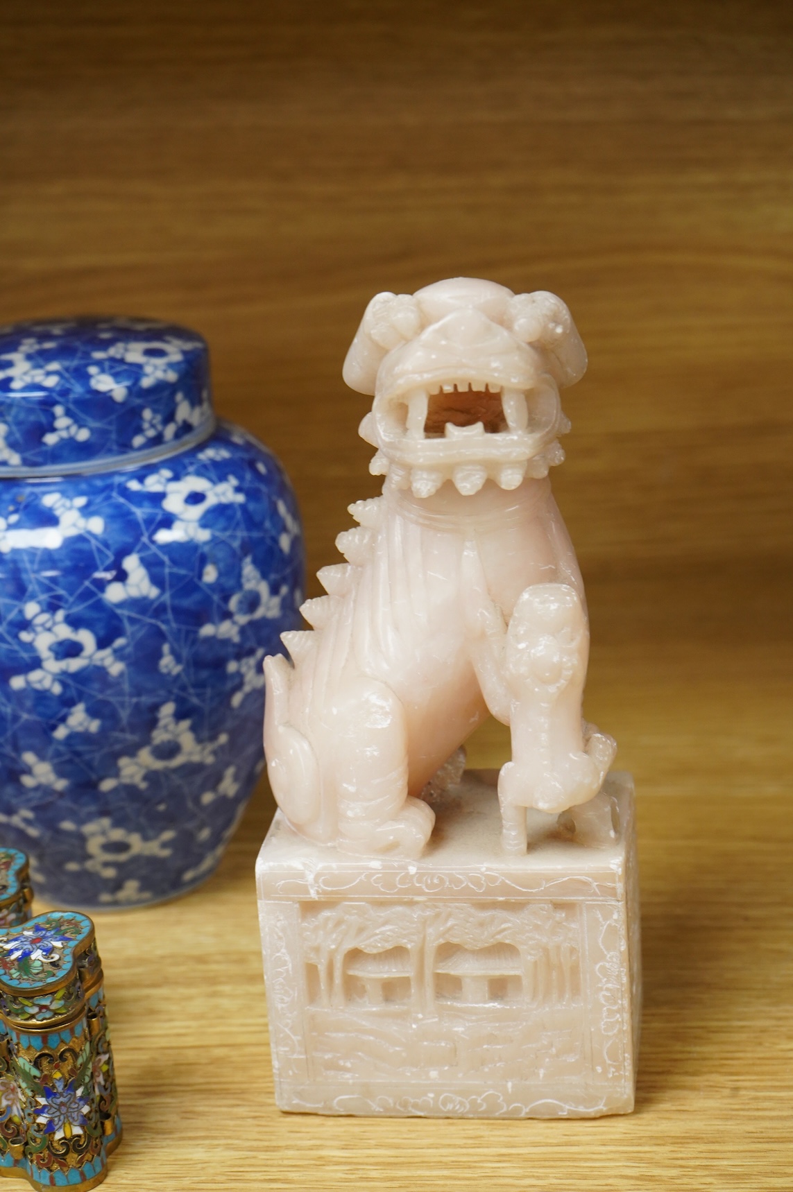 A pair of Chinese soapstone lion-dogs - 22.5cm high, two cloisonné enamel boxes and covers and a blue & white jar & cover